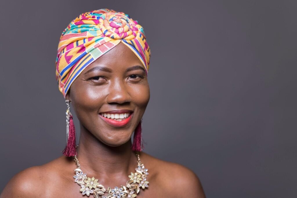 Ghanaian woman in a patterned Duku headscarf