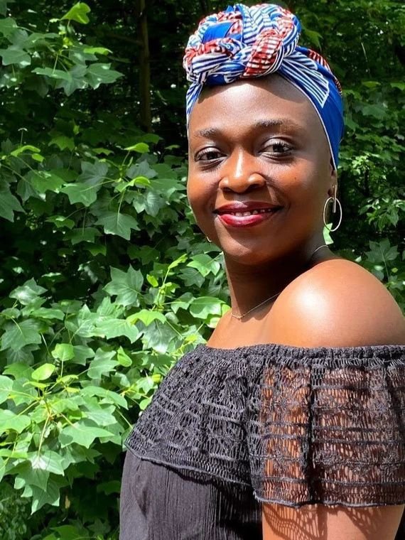 Woman in Southern Africa wearing a neatly wrapped headscarf secured close to the scalp